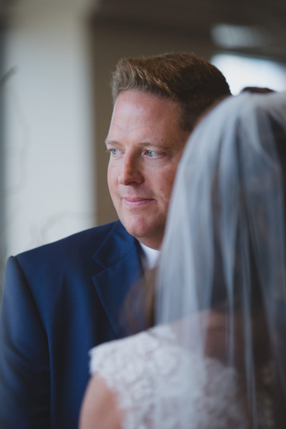 A portrait of a groom during the ceremony at his State Room Wedding in Boston
