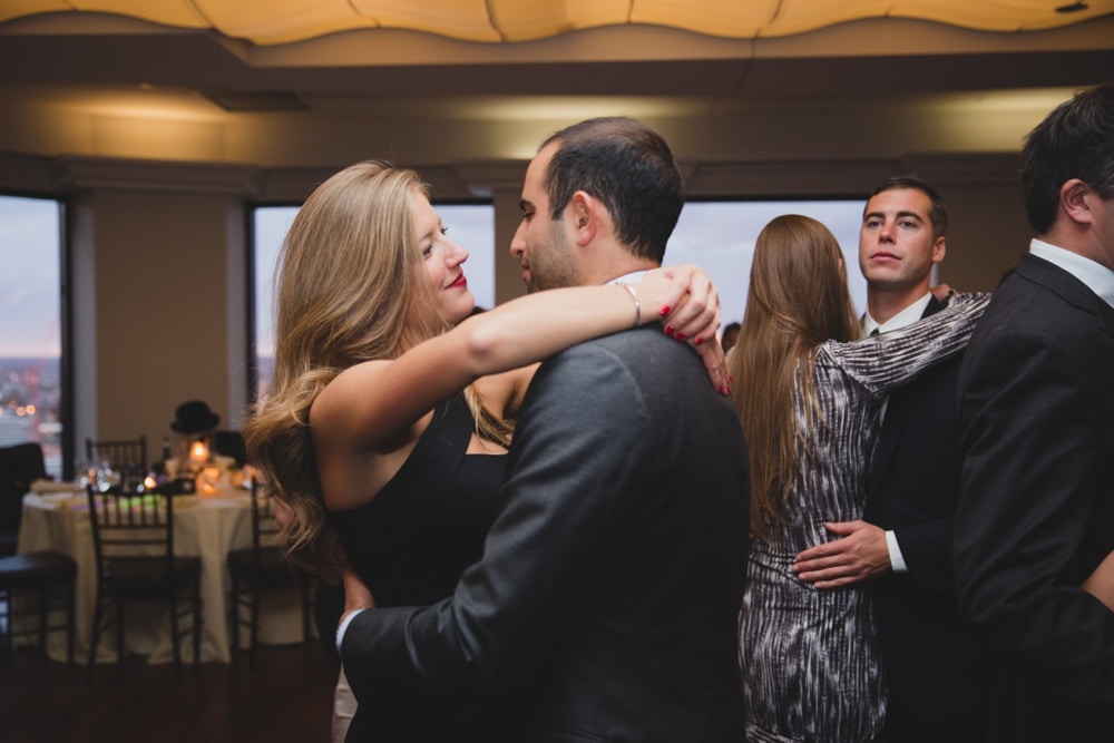 A documentary photograph of a couple dancing during a State Room Wedding in Boston