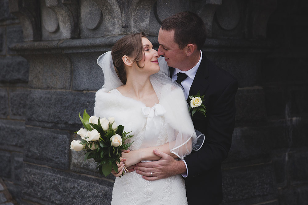 A sweet, natural portrait of a couple cuddling during their wedding portraits in Boston Public Gardens