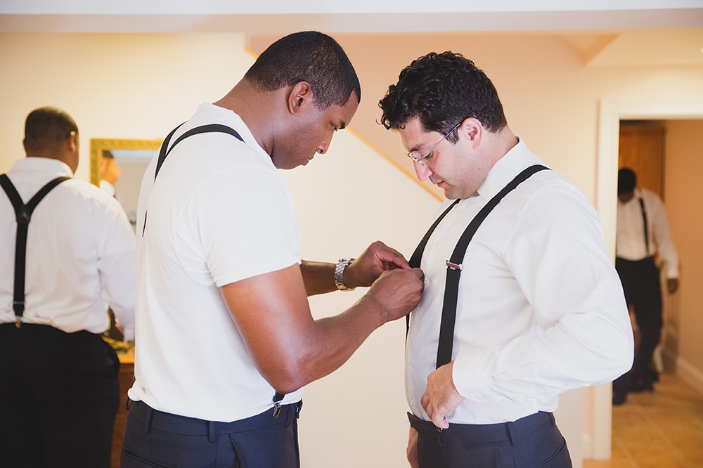 A documentary photograph of two Groomsmen getting ready for a Martha's Vineyard Wedding