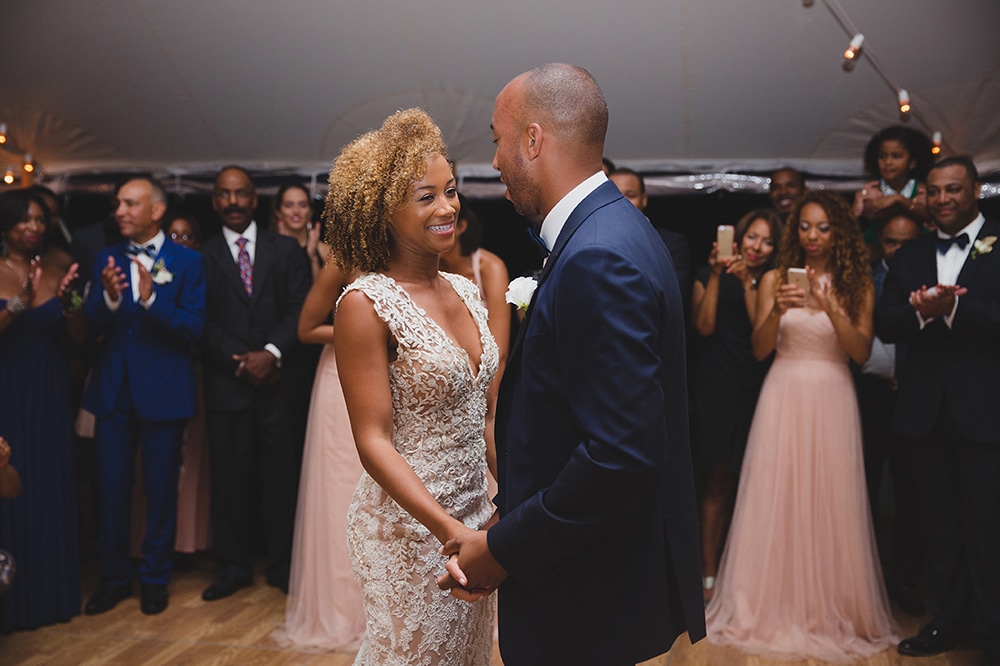 A documentary photograph of a bride and groom sharing a first dance as husband and wife at their Martha's Vineyard Wedding