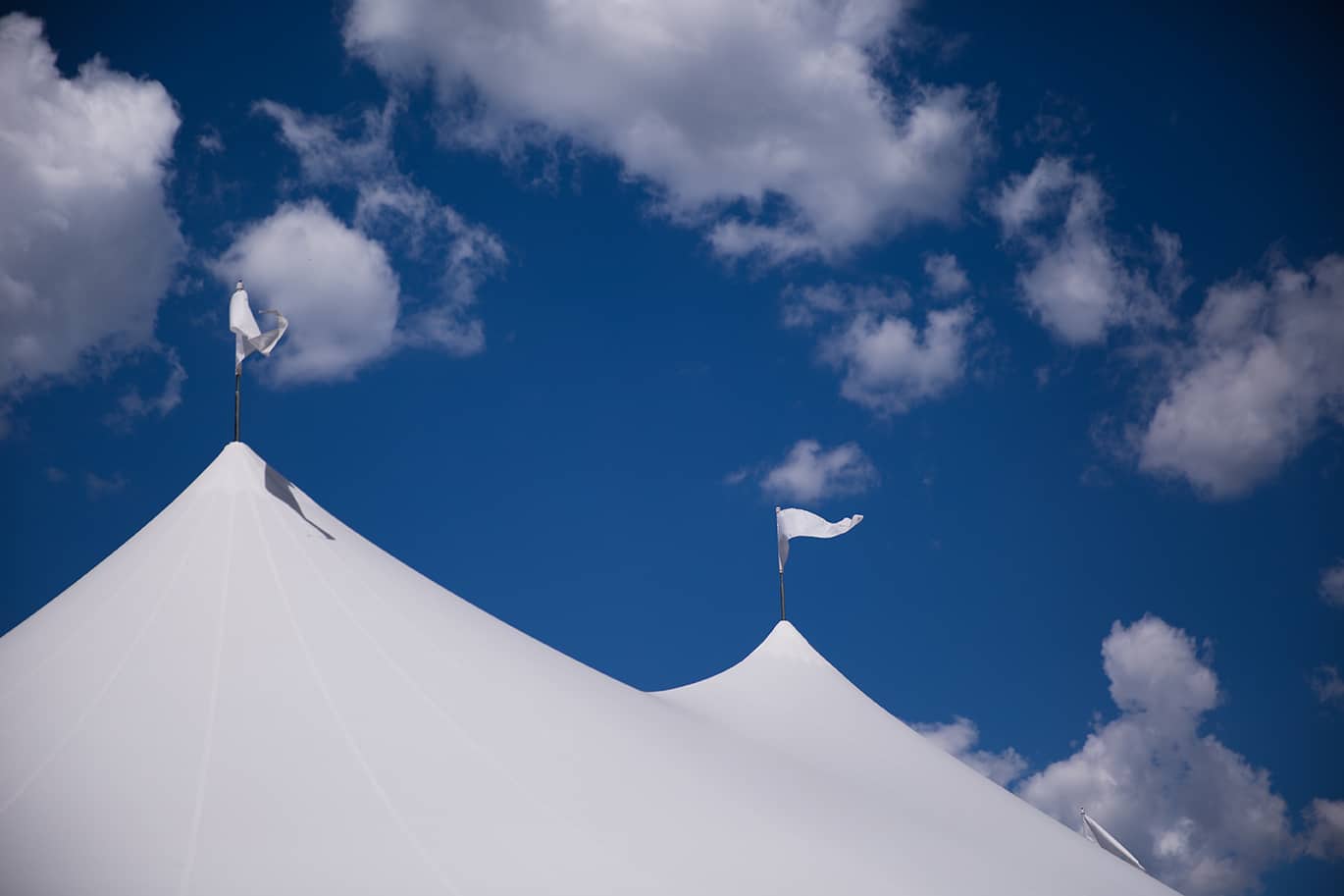 An artistic photograph of the tent and sky during a Friendly Crossways Wedding