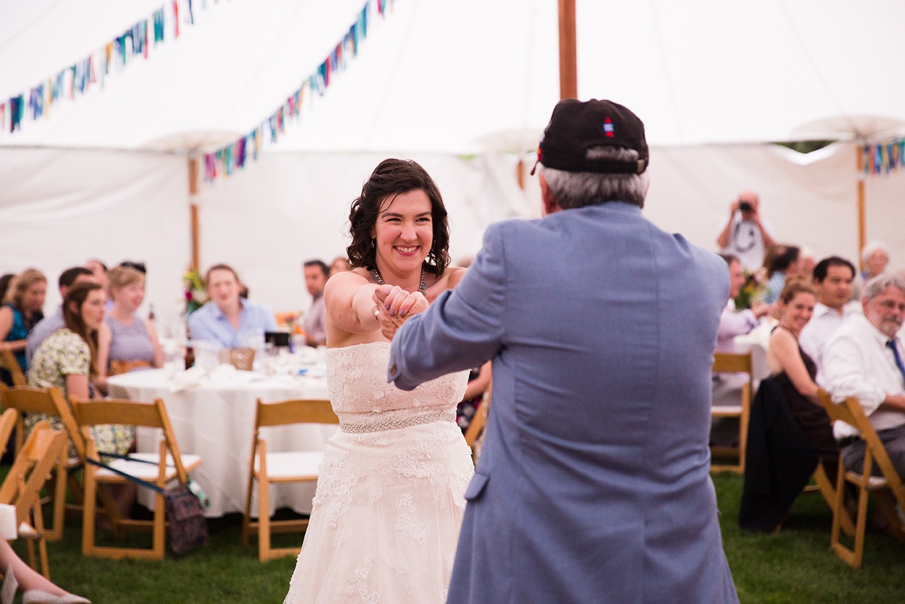 A documentary photograph of a bride dancing with her father during a Friendly Crossways Wedding