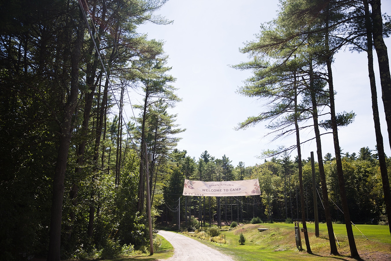 A photograph of the entrance of Kingsley Pines Camp during a summer camp wedding in Maine