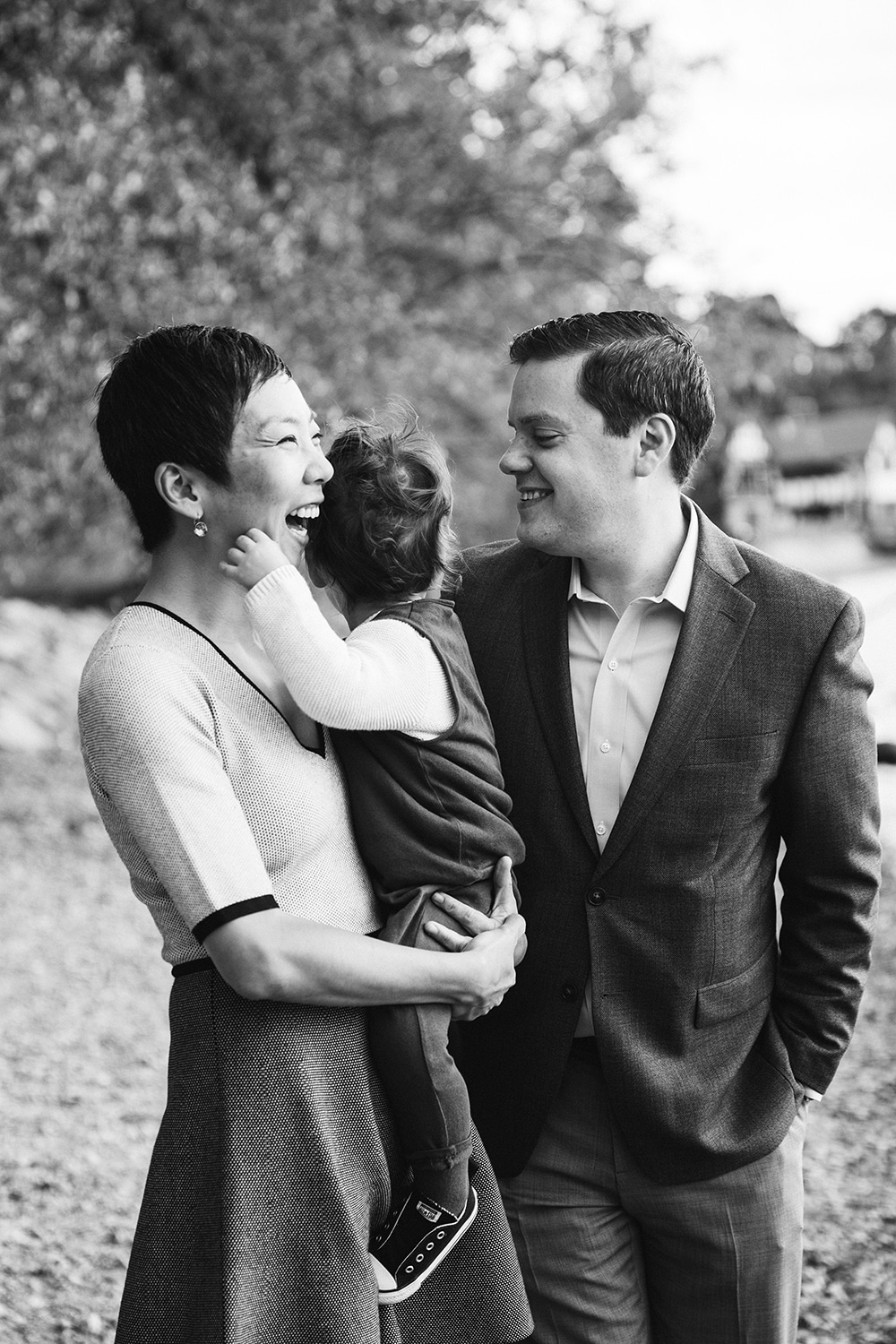 This lifestyle portrait of a family laughing is one of the best family photographs of 2016