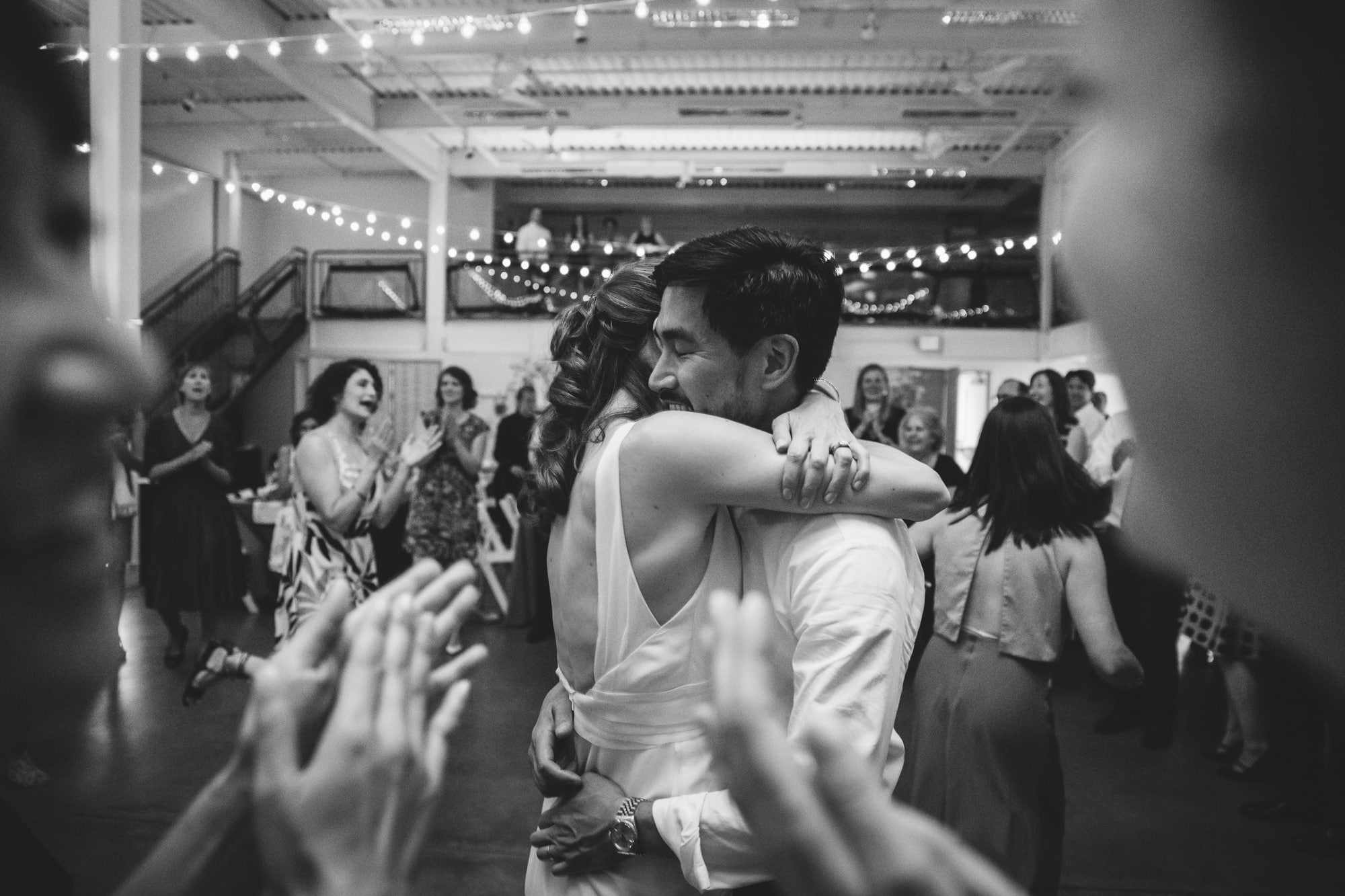This documentary photograph of a bride and groom dancing at their Artists for Humanity Wedding is one of the best wedding photographs of 2016