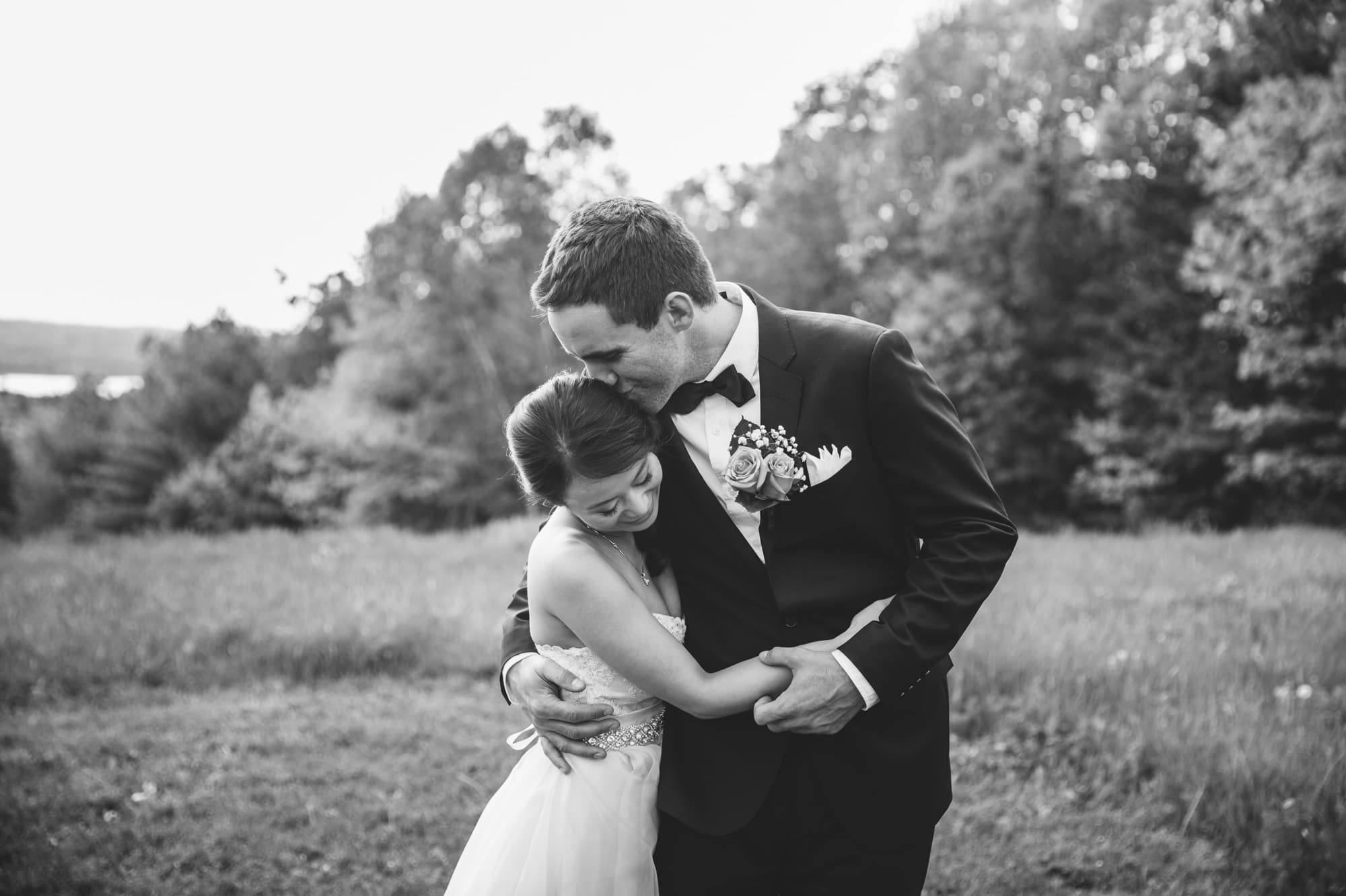 This natural portrait of a bride and groom kissing is one of the best wedding photographs of 2016