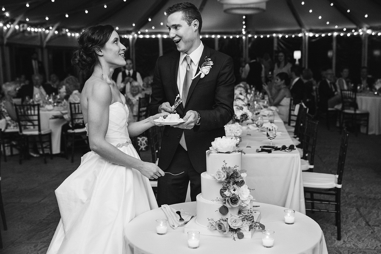This documentary photograph of a bride and groom cutting the cake is one of the best wedding photographs of 2016