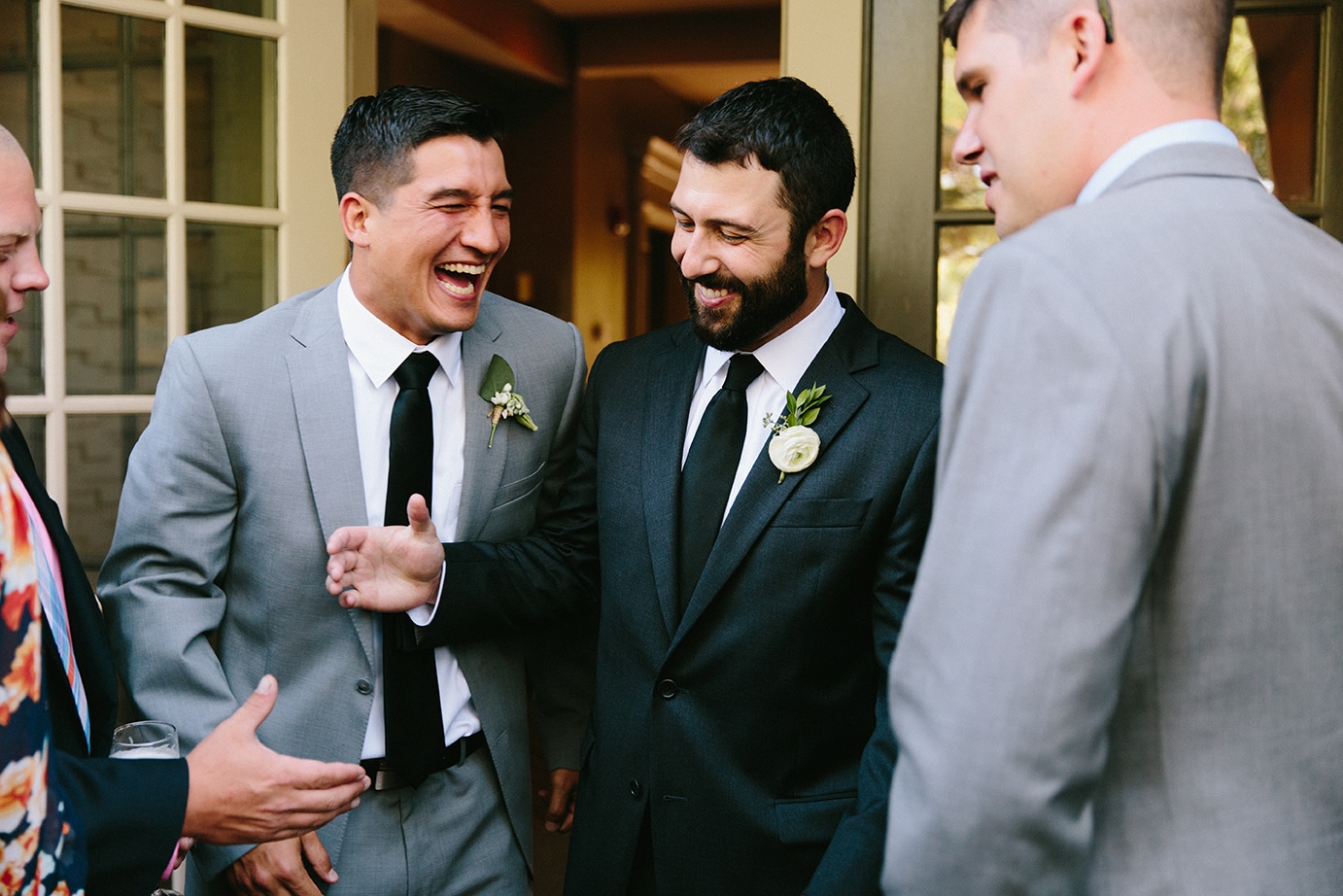 This photojournalistic photograph of a groom celebrating with guests is one of the best wedding photographs of 2016