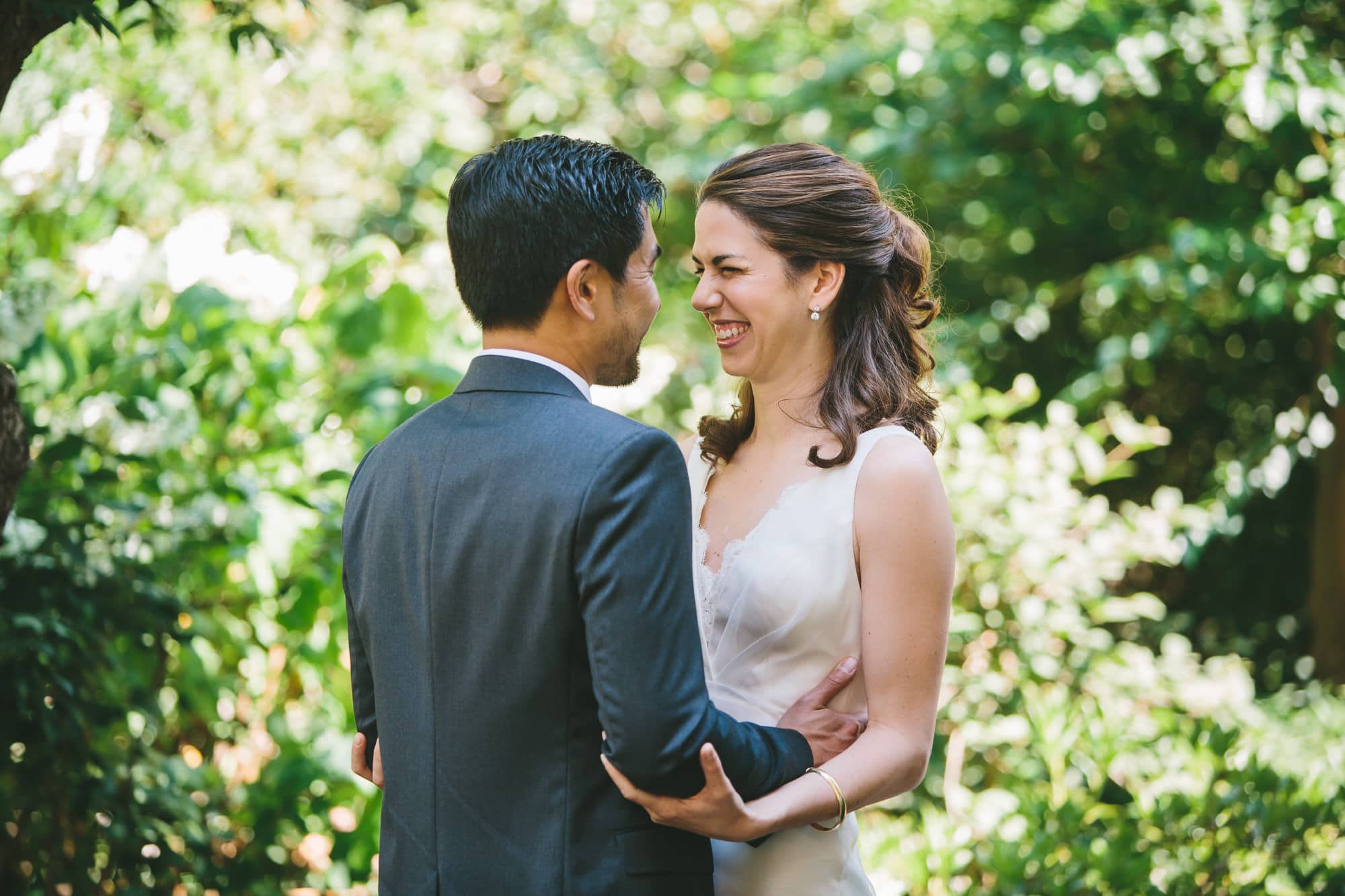 A candid portrait of a bride and groom seeing each other for the first time before their Artists for Humanity Wedding in Boston, Massachusetts