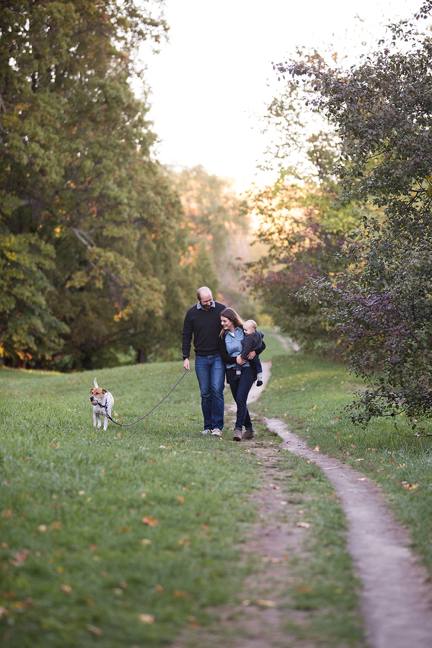 A documentary photograph of a family walking together during their Arboretum Family Session in Boston, Massachusetts