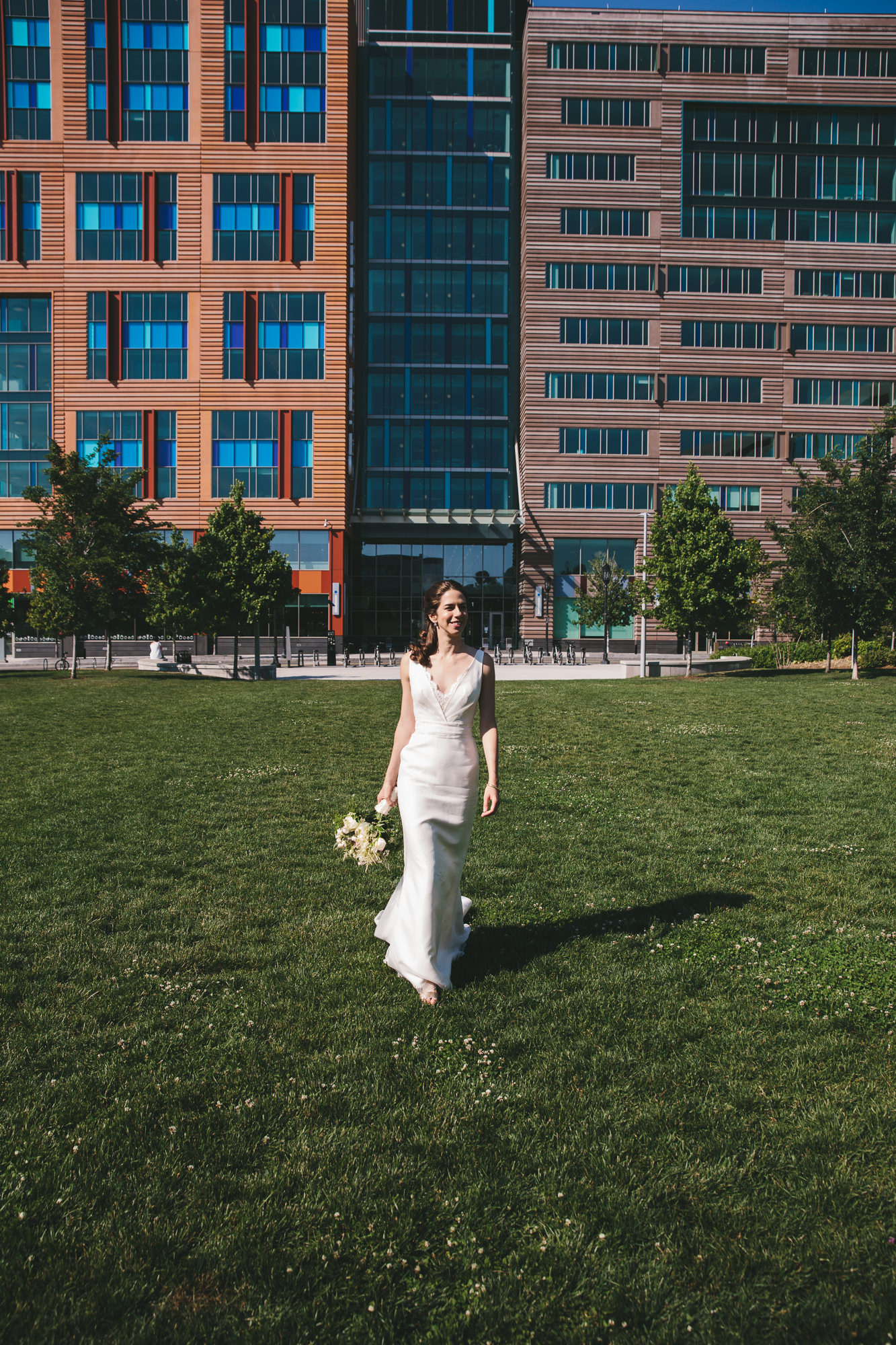 A documentary photograph of a bride walking to her Artists for Humanity Wedding in Boston, Massachusetts