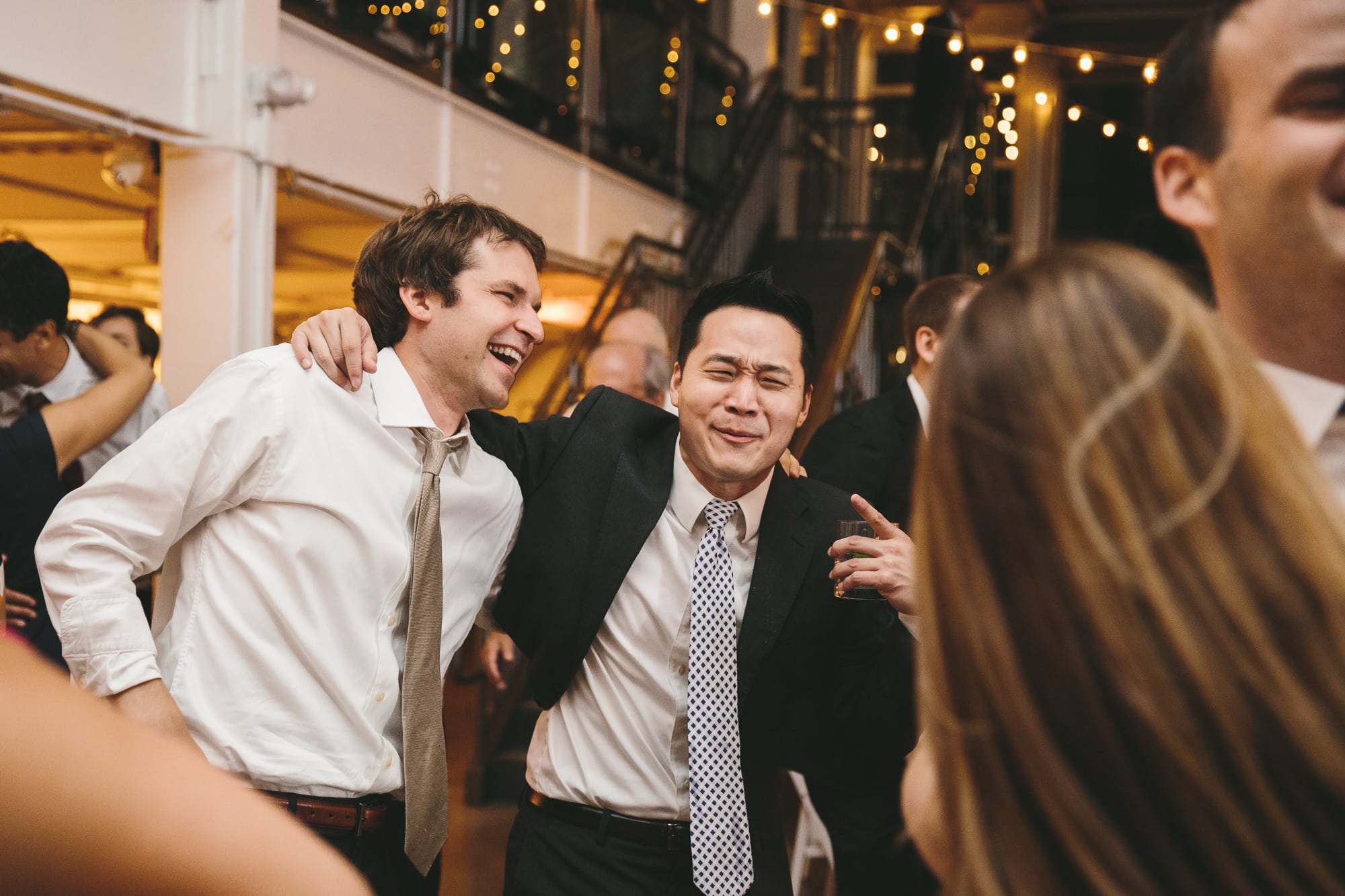 A documentary photograph of guests dancing at an Artists for Humanity Wedding in Boston