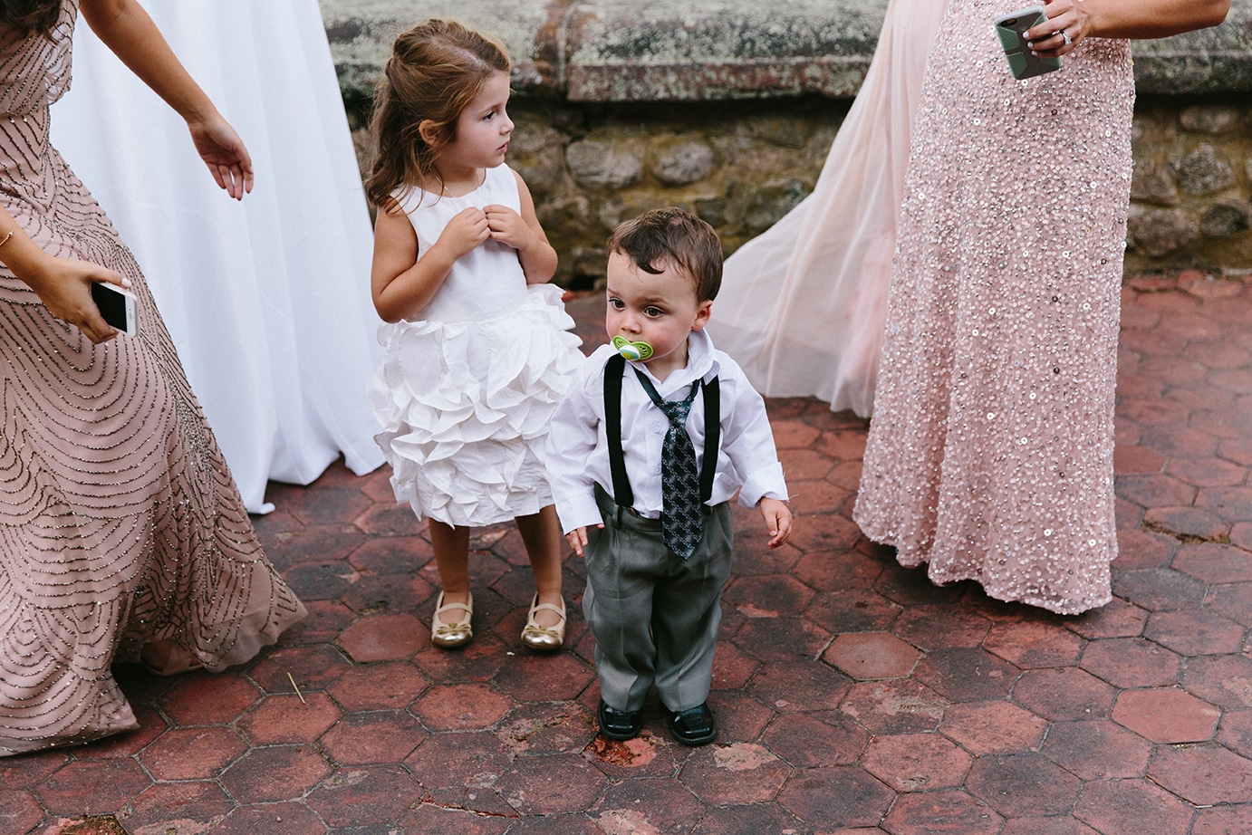 A documentary photograph of a flower girl and ring bearer during a Moraine Farm Wedding in Beverly, Massachusetts