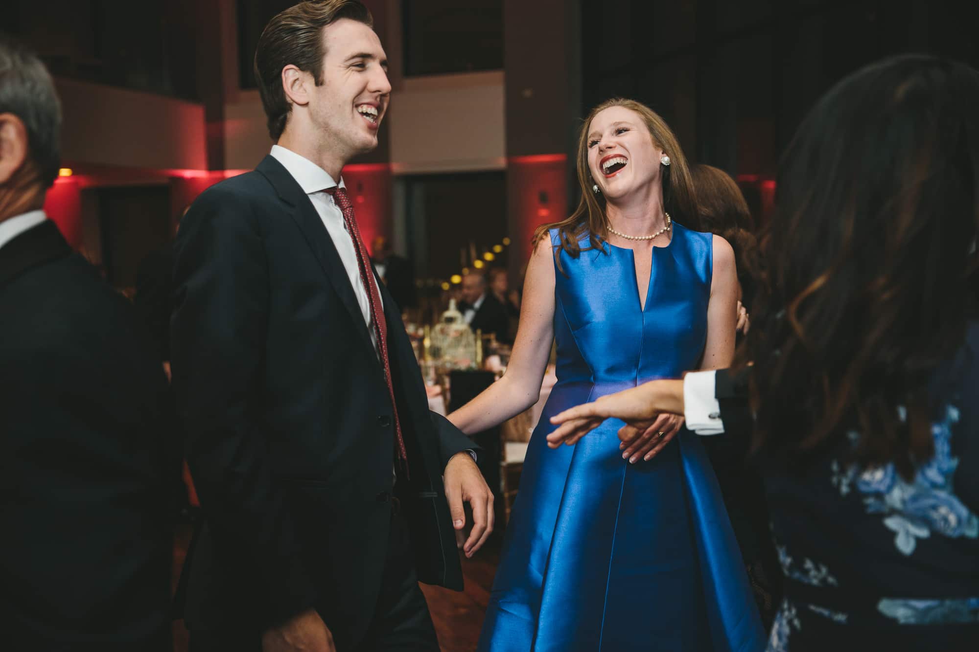 A documentary photograph of guests dancing during a State Room Wedding in Boston, Massachusetts