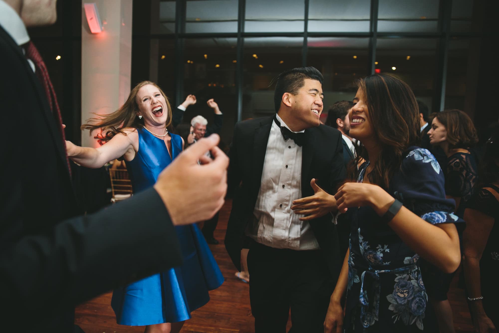 A documentary wedding of guests dancing during a State Room Wedding in Boston, Massachusetts