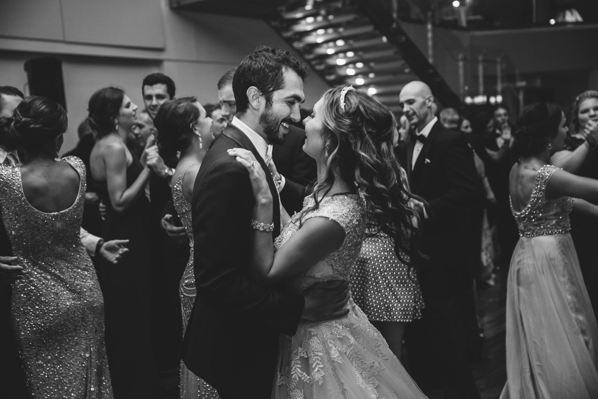 A documentary wedding of a bride and groom dancing during their State Room Wedding in Boston, Massachusetts