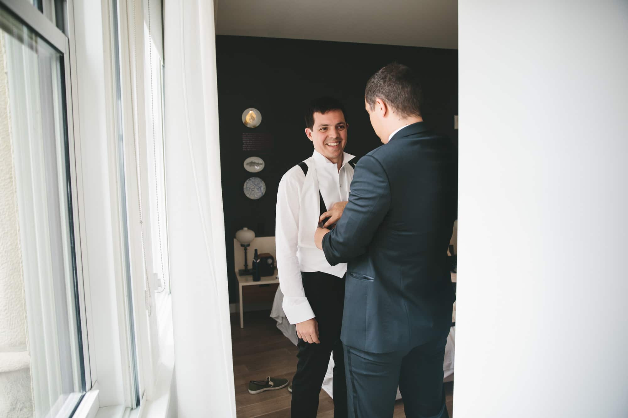 a groom prepares for his state room wedding at the Ames hotel in Boston, Massachusetts