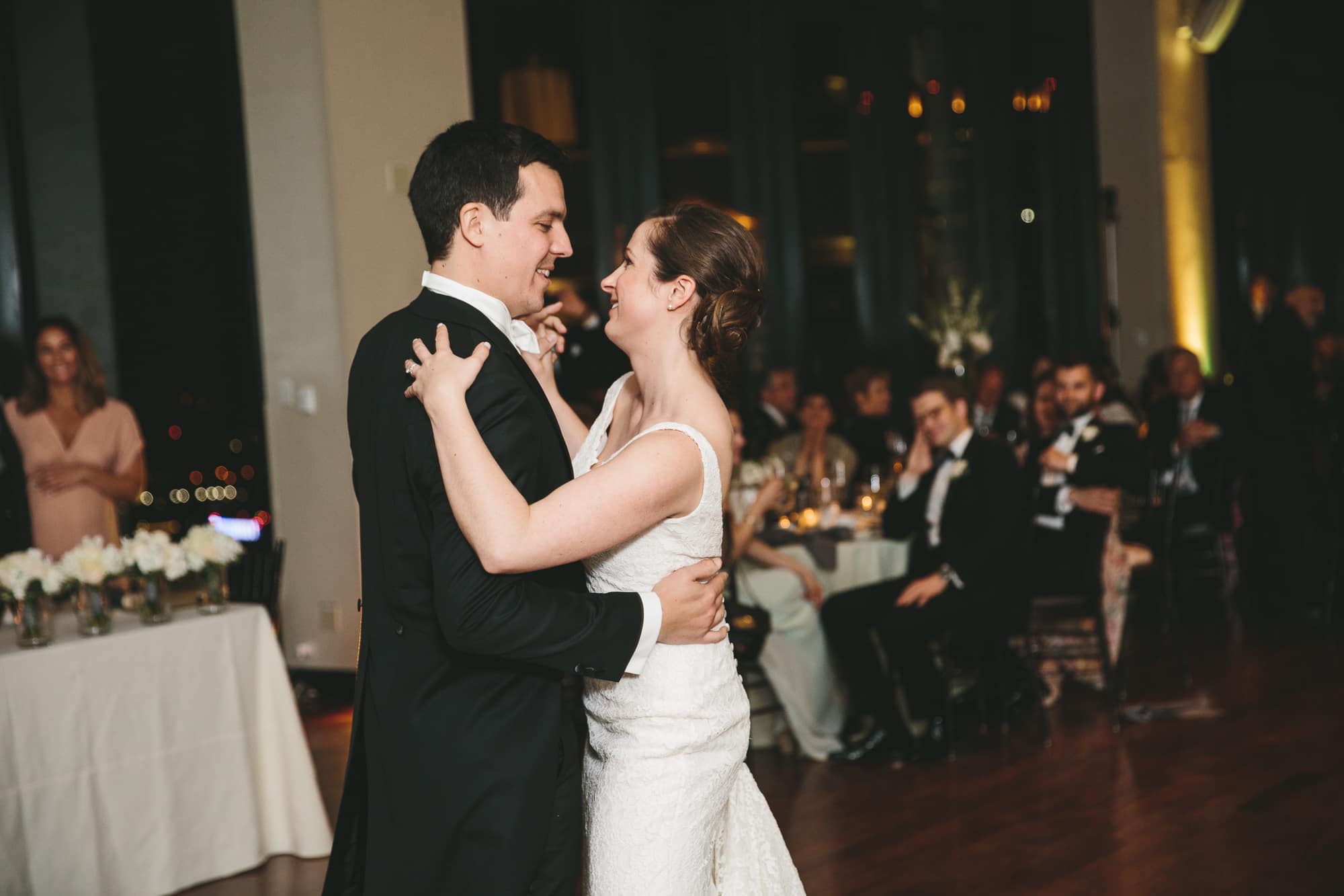 A documentary photograph of a bride and groom sharing a first dance at their State Room Wedding