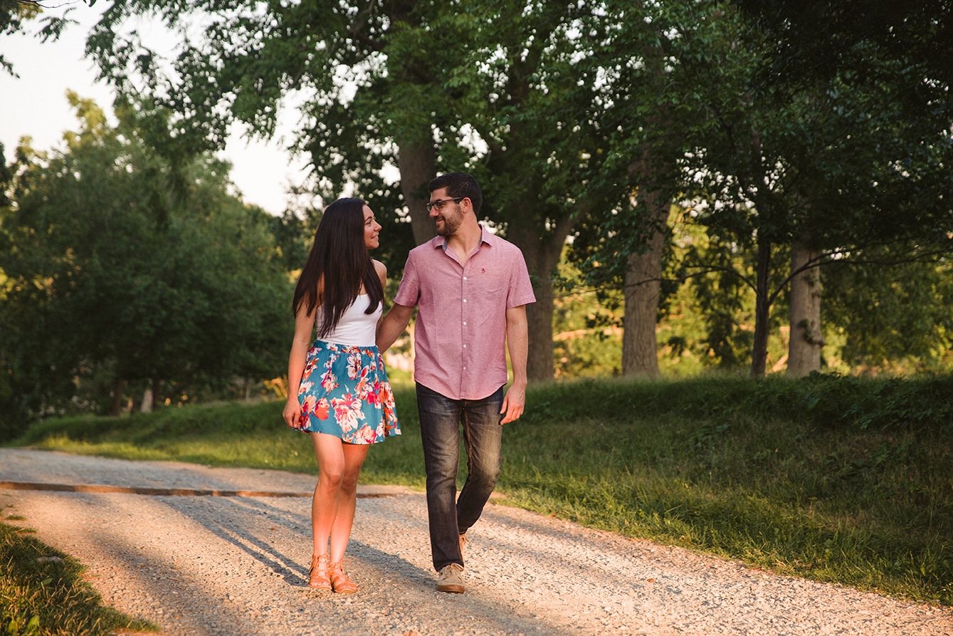 A couple walk together during their World's End Engagement Session in Hingham, Massachusetts