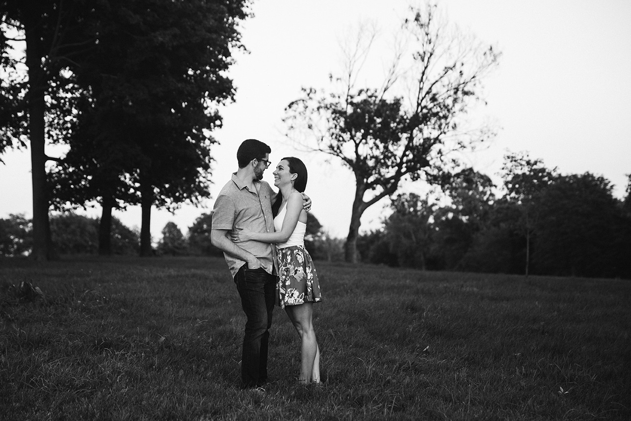 A documentary photograph of a couple hugging during their World's End engagement session in Hingham, Massachusetts