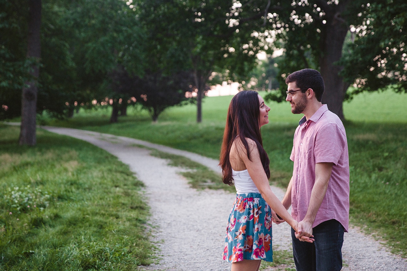 A documentary photograph of a couple talking during their engagement session at the World's End in Hingham, Massachusetts