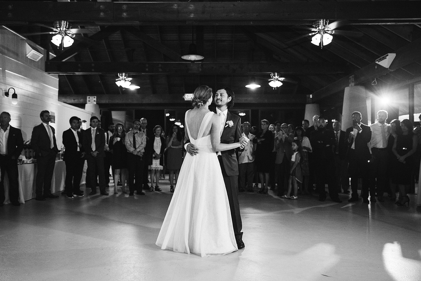 A documentary photograph of a bride and groom sharing their first dance at a plimoth plantation wedding in plymouth, massachusetts