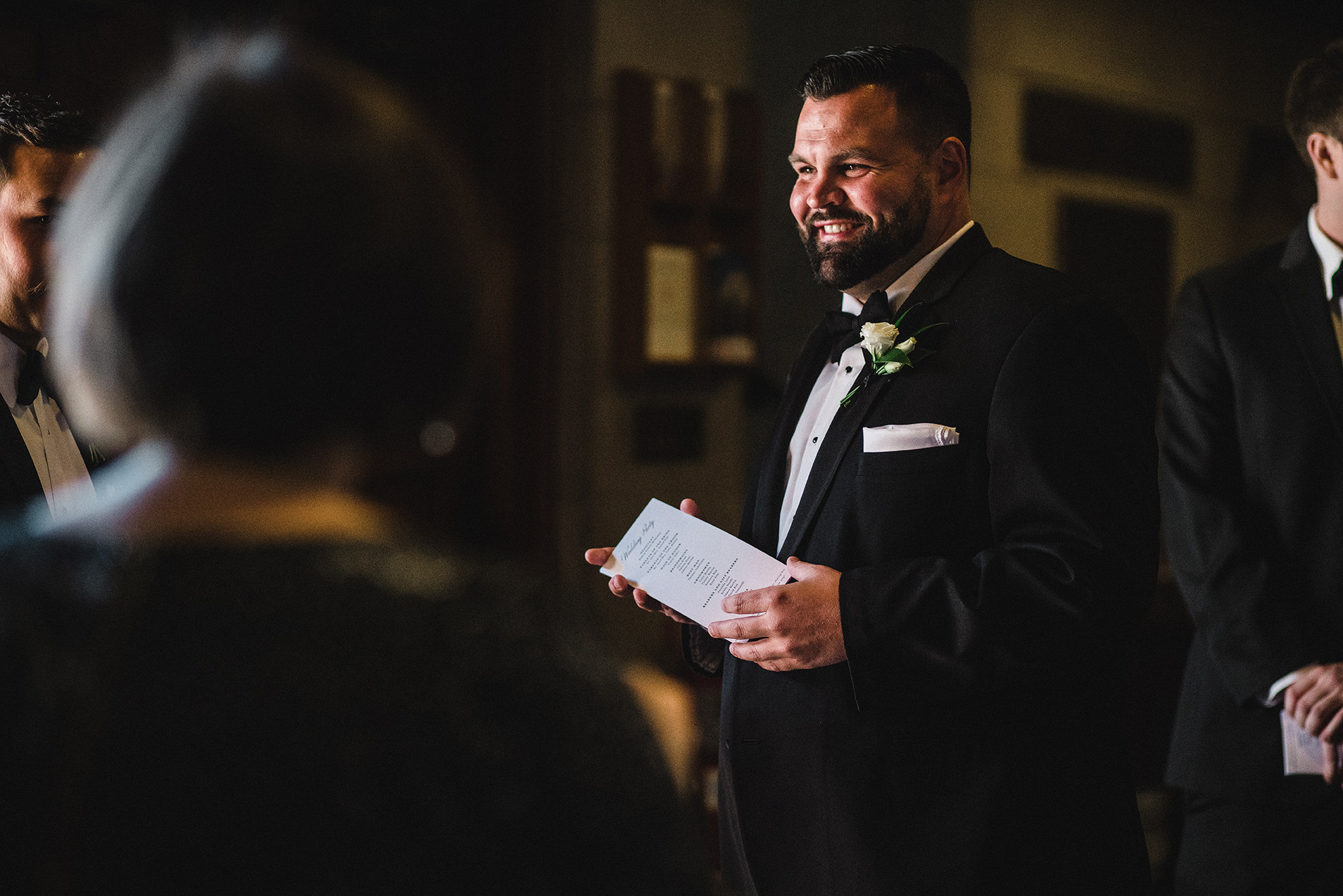 A documentary photograph of guests laughing before a Boston Wedding Ceremony at Marsh Chapel