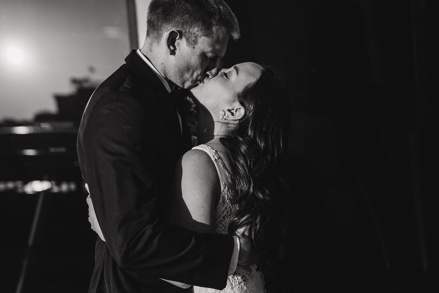 A candid portrait of a bride and groom kissing during their fairmont copley wedding in boston