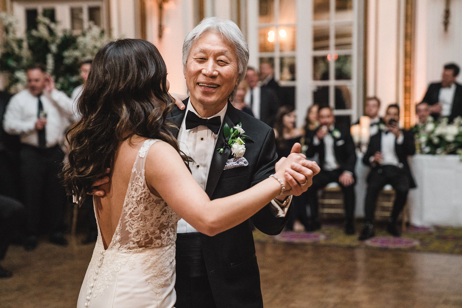 A documentary photograph of the father daughter dance at a fairmont copley wedding