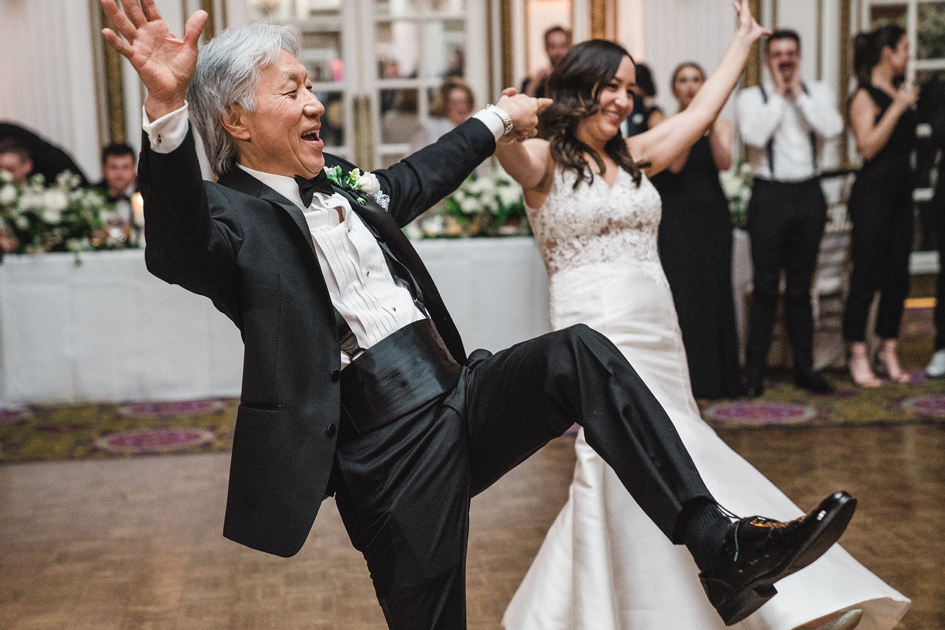A documentary photograph of the father daughter dance at a fairmont copley wedding