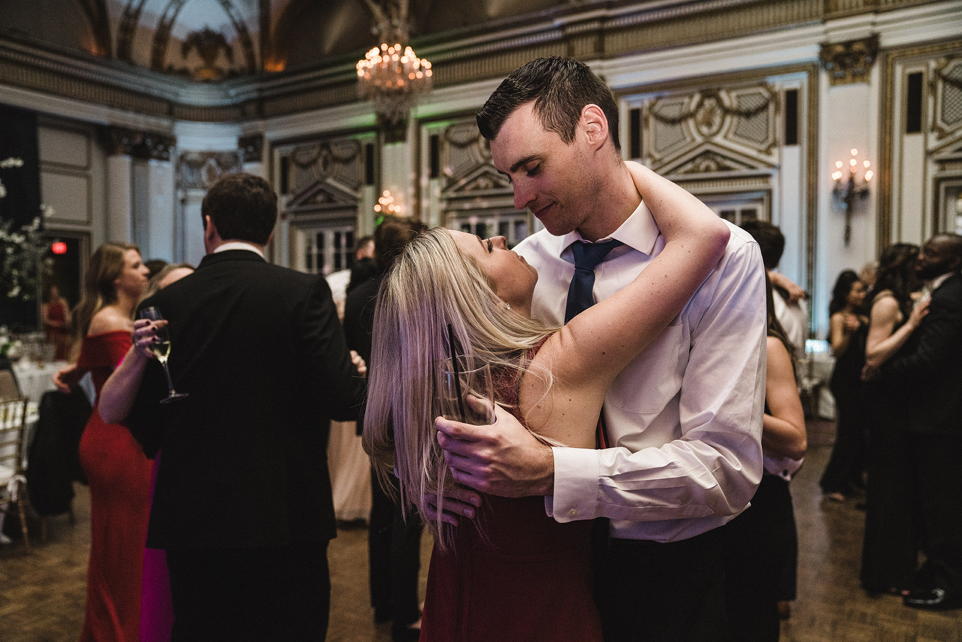 A documentary photograph of guests dancing at a fairmont copley wedding