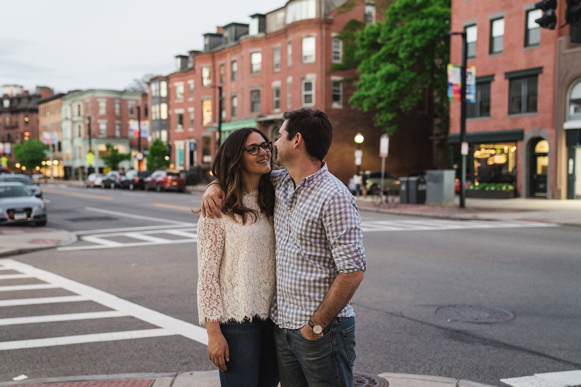 A documentary photograph of a couple talking during their South End Boston Engagement Session