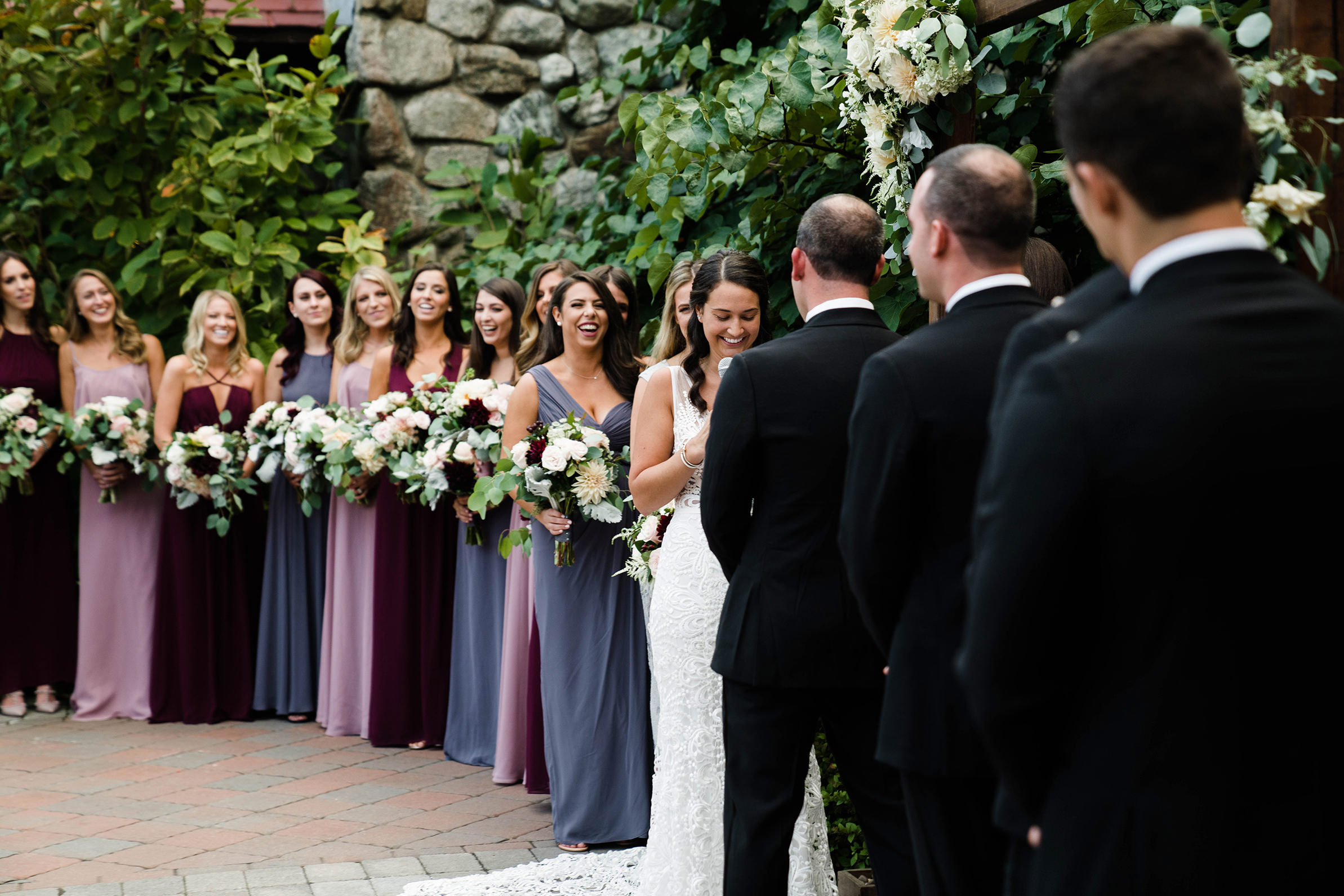A best of Boston wedding photograph of a bride reading her vows during a Willowdale estate wedding outside of Boston