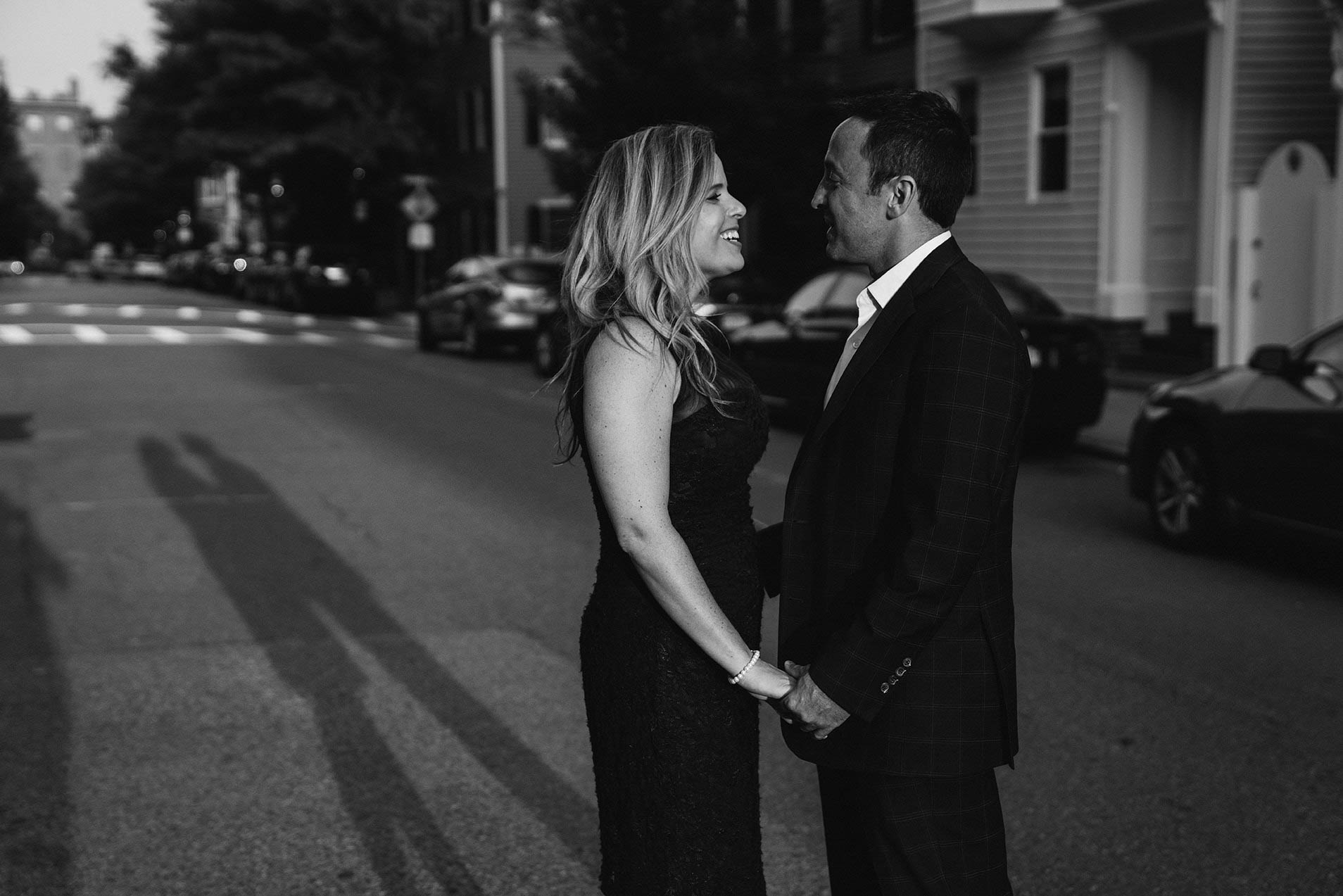 A documentary portrait of a couple holding hands during their Boston Engagement Session