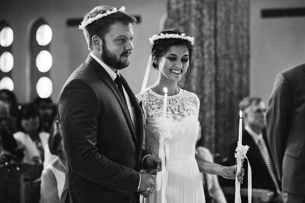 A documentary photograph of a bride and groom during their greek wedding ceremony in Boston