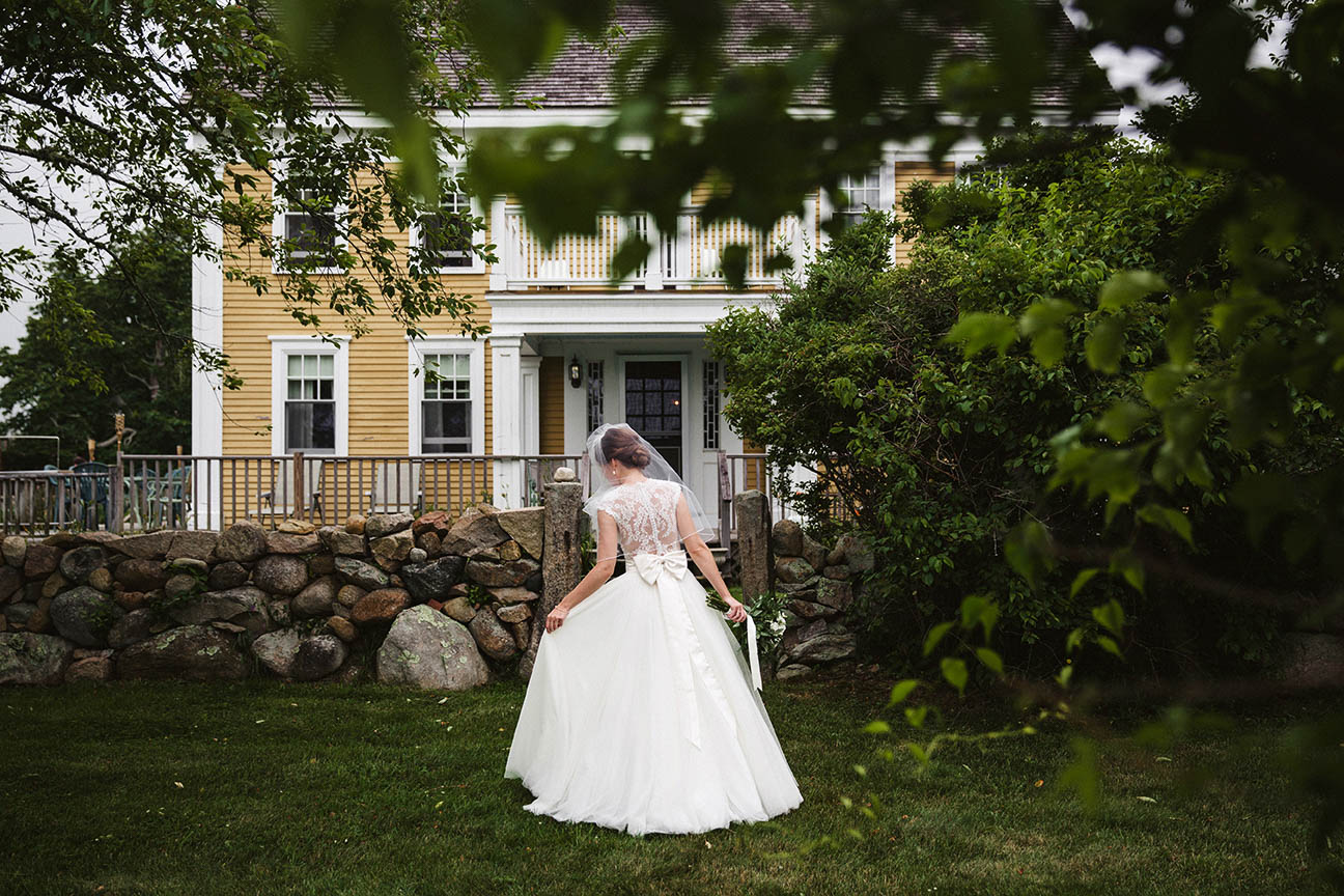 A documentary photograph a bride walking towards her Boston wedding