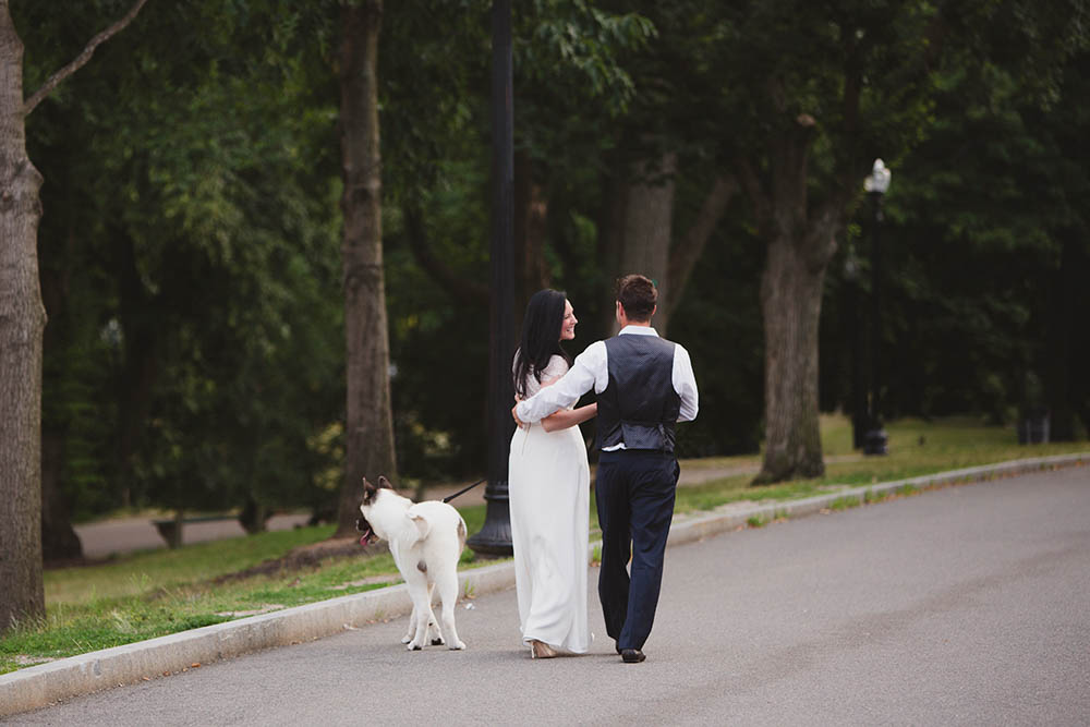 A documentary portrait of a couple walking together in the Common during their Boston engagement session