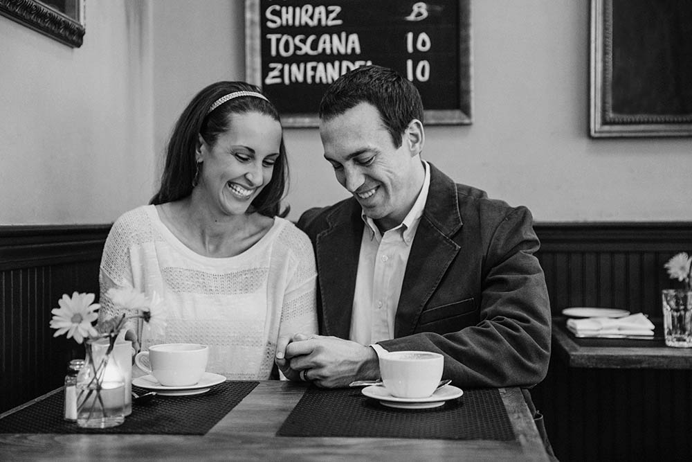 A documentary portrait of a couple having a coffee together in Beacon Hill during their Boston engagement session