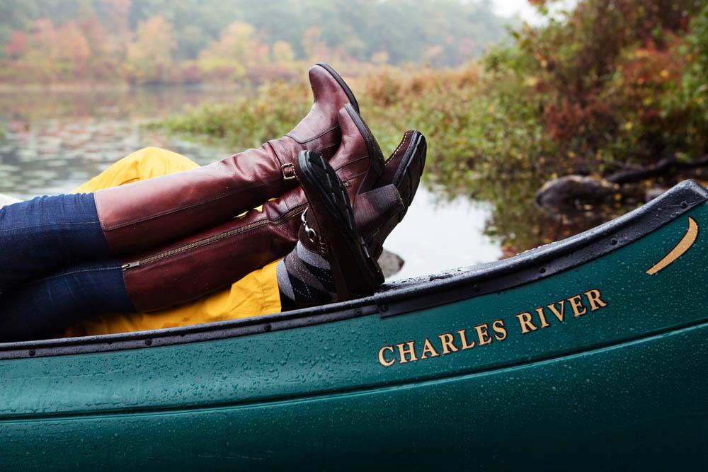 A documentary portrait of a couple hangin out in a canoe on the Charles River during their Boston engagement session