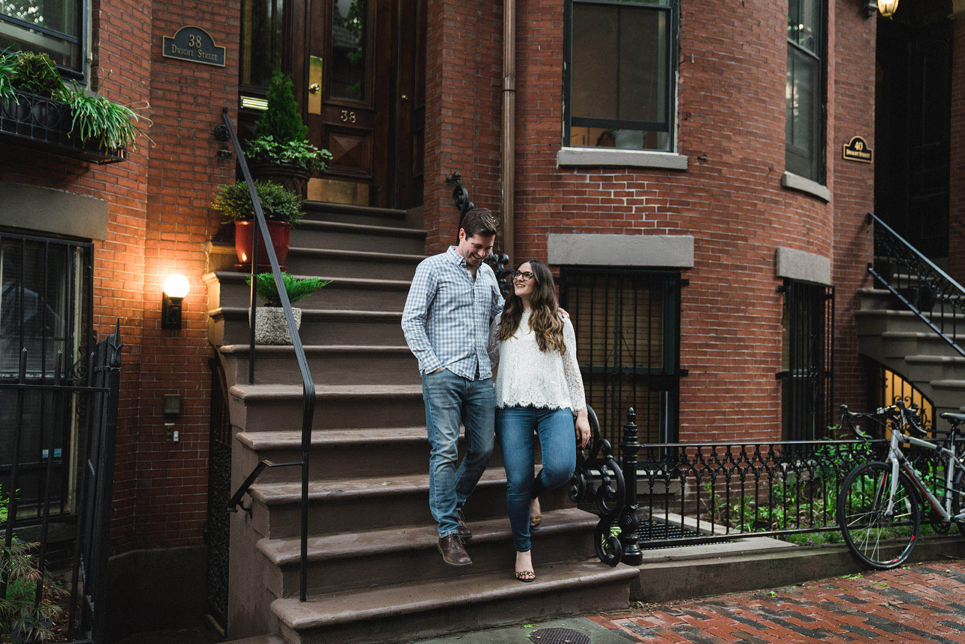A documentary portrait of a couple leaving their home in the South End during their Boston engagement session