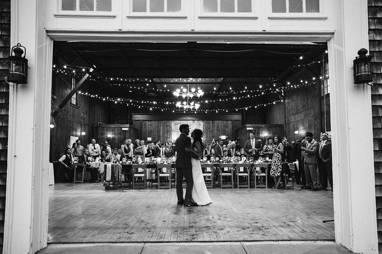 A documentary photograph of a couple having their first dance during their Mount Hope Farm wedding