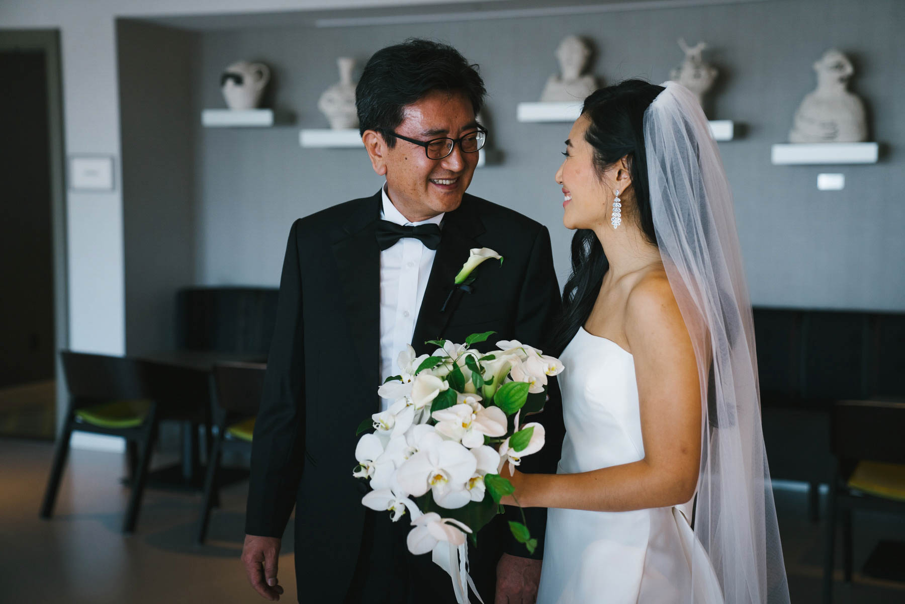 A documentary photograph of a bride and her father before her wedding at Commonwealth hotel in Boston
