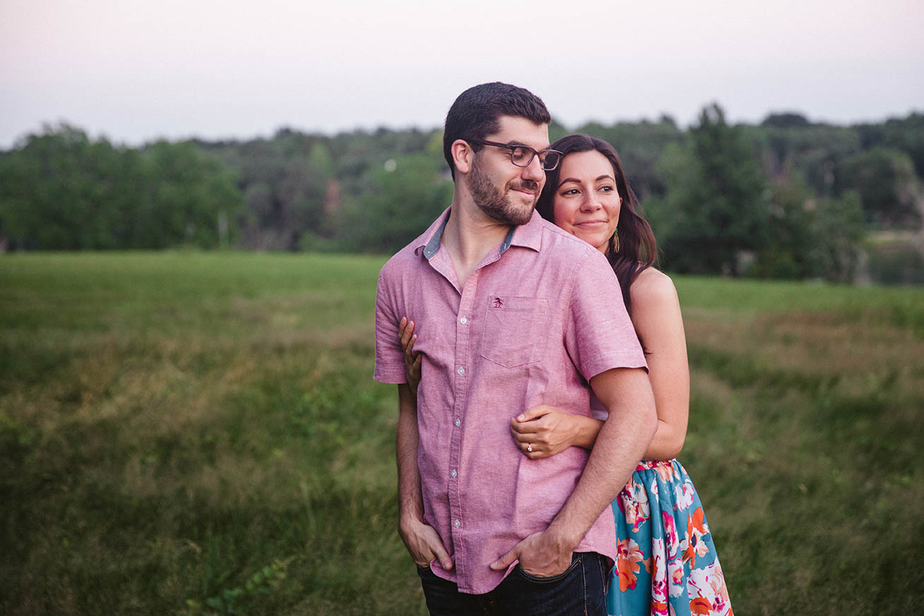 A documentary portrait of a couple hugging at the World's End during their Boston engagement session