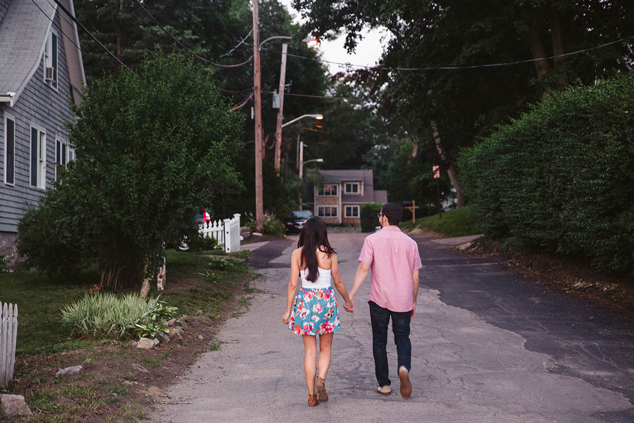 A documentary portrait of a couple walking back home after their time at the World's End during their Boston engagement session