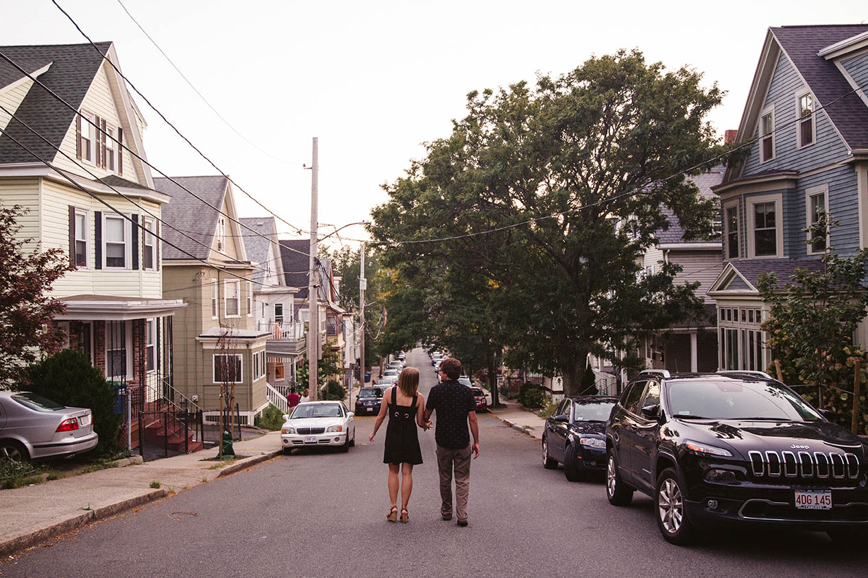 A documentary portrait of a couple walking home after their Boston engagement session