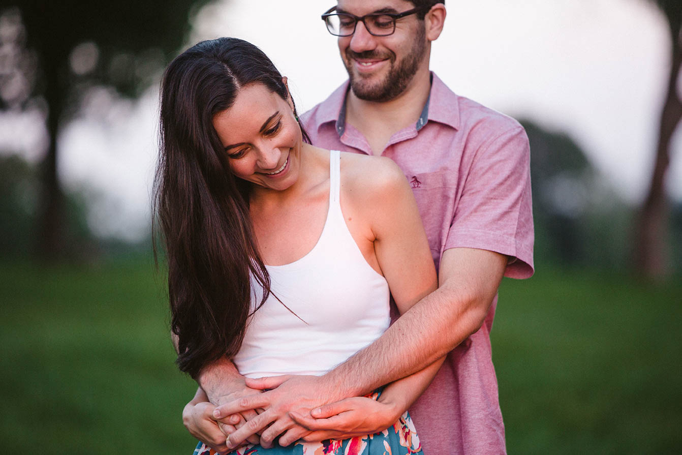 A documentary portrait of a couple hugging at the World's End during their Boston engagement session