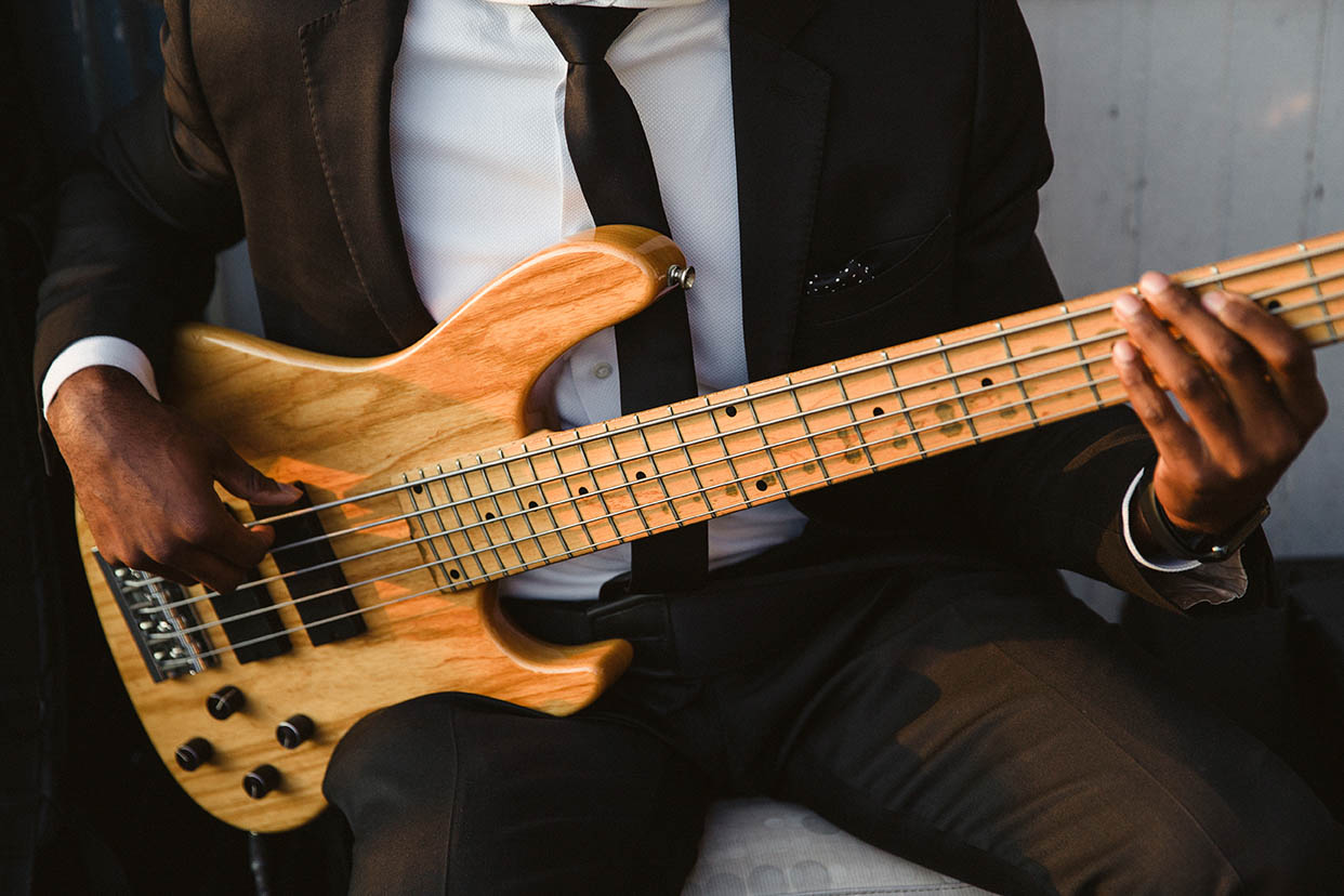 A documentary photograph of musician playing the electric guitar at a Boston wedding