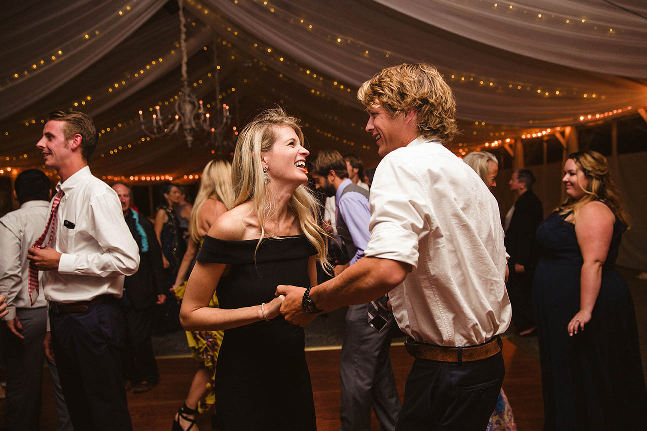 A documentary photograph of a couple dancing at a Castle Hill Inn wedding