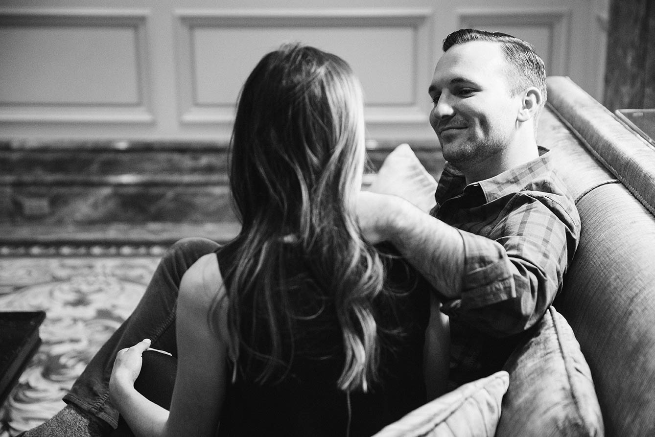 A documentary portrait of a couple hanging out and having a drink during their Boston engagement session